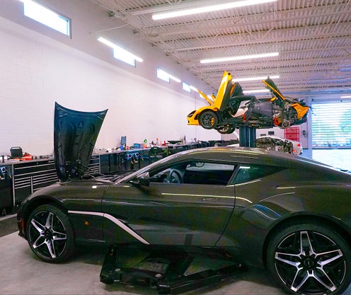 Aston Martin automobiles being serviced at the Ultra Luxury Service Center
